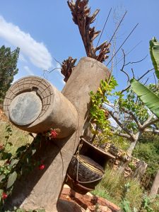 As a writer and artist, I thought that unbearable human-hate statement should be given a permanent international social landmark for the people from Trump’s shithole nations. I thought of marking that landmark by building a giant Donald Trump sculpture housing two real and practical shithole chambers. A male shithole chamber and a female shithole chamber, whereby the two chambers carry whatever practical amenities for comfortable business in the chamber. The shitholes would be open to the public in memory of President Trump’s racial abuse. Behind the Trump’s front image, is a small lodge house to accommodate any visitor interested in the Trump’s shithole accommodation. 